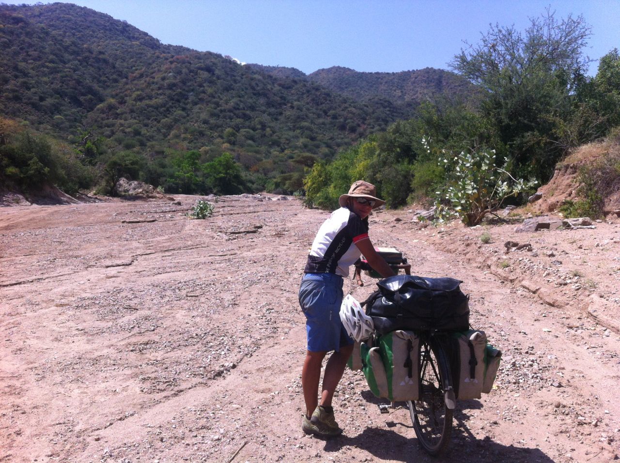 Hauling our bikes along a dried up river bed between Arbore and Turmi, Ethiopia